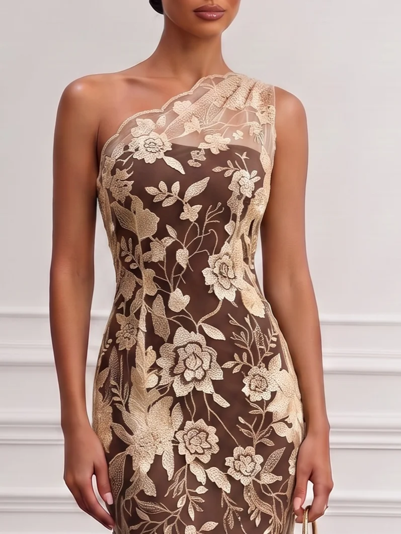 Scalloped one shoulder neckline and floral embroidery detail